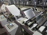 Machine à plastifier pour papier à cigarettes