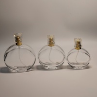 Échantillon gratuit, flacon de parfum en verre vide avec logo personnalisé, nouveau design, 30 ml, 50 ml, 100 ml, flacon de parfum rond plat de luxe