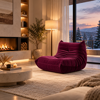 Fauteuil lounge Caterpillar en velours bordeaux, rembourrage dense, toucher doux, soutien ergonomique, qualité durable, confort optimal