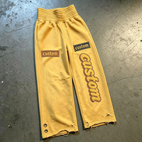 Pantalon de survêtement personnalisé 100% coton, coupe large, taille haute élastique, effet vintage délavé, avec broderie de patchs verticaux effilochés