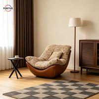 Fauteuil lounge Cloud de luxe, fauteuil d'appoint rembourré en tissu avec base en cuir ciré, mobilier moderne pour salon