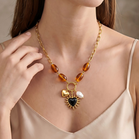 Collier en acier inoxydable avec perles de résine ambrée, breloque cœur noir soleil, fausse perle, fermoir OT plaqué or 18 carats, bijoux inaltérables