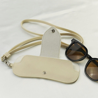 Nouveau sac de rangement pour lunettes de cou suspendu en cuir PU créatif étui anti-perte portable pour les lunettes de soleil de protection solaire de plage