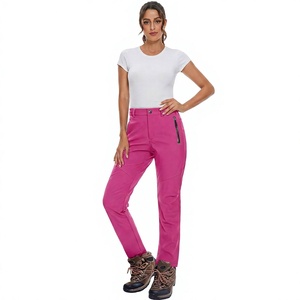 Pantalones de esquí impermeables color rosa para mujer con bolsillos con cremallera y tecnología 10000mm para actividades al aire libre en la nieve - Product Image 1