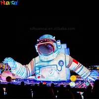 Modèle géant gonflable d'astronaute pour scène de carnaval, énorme astronaute gonflable couché sur la Lune, personnalisé avec éclairage