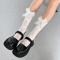 Chaussettes longues en dentelle résille pour filles de luxe avec grand nœud noir et blanc longueur d'équipage respirant et élégant pour la saison d'automne