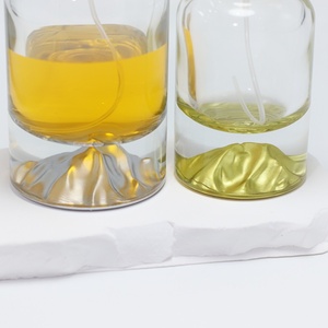 Bouteilles de parfum cylindriques en verre OEM/ODM 30ml 50ml 100ml avec fonds sérigraphiés or/argent/bleu/rouge/vert et pulvérisateur à pompe pour cadeau - Product Image 4