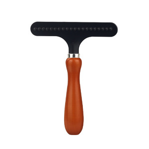 Peigne de toilettage pour animaux de compagnie avec poignée en T, brosse en silicone pour éliminer les poils de chien et de chat - Product Image 1