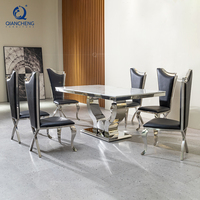 Ensemble de table à manger en marbre et acier inoxydable pour la salle à manger des maisons, avec 6 chaises