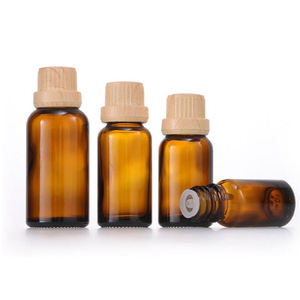 Botella de aceite esencial de vidrio ámbar cosmético con cubierta de madera de bambú falsa de China con tapa de Bambú - Product Image 5