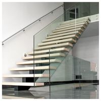 Escalier flottant moderne Prima avec poutre en acier au carbone et garde-corps en verre pour villa