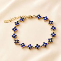Nouveauté transfrontalière : Bracelet trèfle à quatre feuilles, design élégant et avant-gardiste, entièrement pavé de zircons, haute qualité