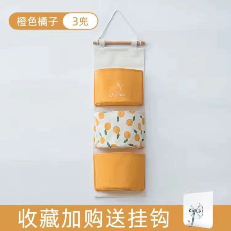 Bolsa colgante naranja de tres bolsillos