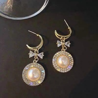 Pendientes de perlas de imitación con lazo de temperamento para mujer, nicho redondo de moda y versátil y pendientes personalizados al por mayor