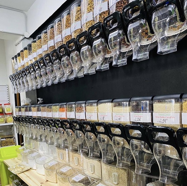 Modern Candy Store Design with Transparent Gravity Feed Wall Dispensers