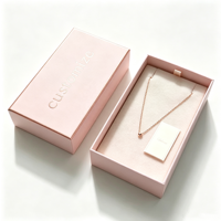 Boîte à bijoux rigide de luxe rose poudré à deux compartiments avec logo personnalisé, doublure en velours nude gaufré, emballage de gros
