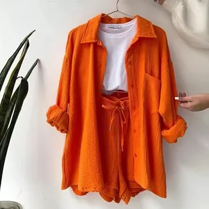 Bộ đồ công sở nữ chất liệu satin trơn, kiểu dáng thường ngày, gồm áo sơ mi nhăn, quần ống rộng ngắn, tay dài, có túi, cài khuy, dáng rộng - Product Image 2