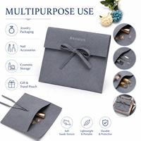 Pochette à bijoux multi-usages en microfibre grise avec fermeture à nœud en ruban, logo en feuille d'or, personnalisable OEM, pochette de rangement pour maquillage et rouge à lèvres