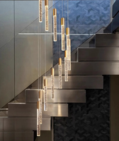 Long lustre de lampe d'escalier de luxe simple moderne avec phare rotatif en métal rond en verre pour Villa Loft Appartement Salon