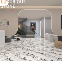 Carreaux de céramique de luxe à texture pierre dorée fluide 600x600mm, polis haute brillance, antidérapants pour sols de KTV, bars et clubs