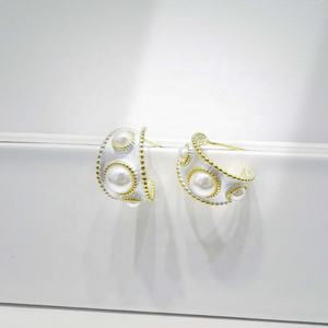 Boucles d'oreilles élégantes rétro en argent sterling 925 plaqué or 18 carats, forme nœud, perle de coquillage, tendance, uniques, pour femme, prix usine. - Product Image 1