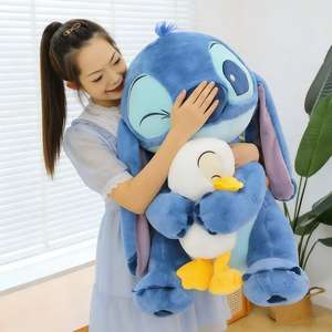 Peluche Alien Blu con Piedoni Che Abbraccia un'Anatra, Pupazzo Grande Super Morbido - Product Image 1