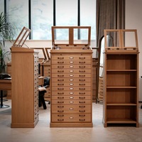 Vitrine à lunettes vintage en bois massif avec plusieurs tiroirs, éclairage LED, design écologique |   Vitrine équipée d'un miroir rabattable