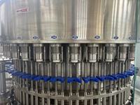 Machine de remplissage automatique de liquides pour ligne de production d'eau pure en bouteille PET
