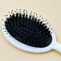 Brosse à cheveux à coussin d'air avec manche blanc, poils en nylon et en poils de sanglier pour le massage quotidien du cuir chevelu et le coiffage des cheveux