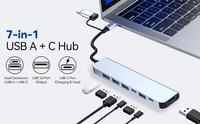 Hub USB-C 7-en-1 en alliage d'aluminium avec ports USB-A, lecteur de cartes MicroSD et SD, design compact pour tablettes et smartphones