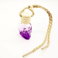 Vente en gros de flacons de parfum pour voiture en verre en forme de crâne colorés de 8 ml, flacons vides pour diffuseur d'air frais pour voiture avec couvercles en bois
