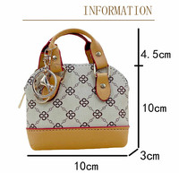 Tas Mini Kulit PU Mewah 2026 Gantungan Kunci Dompet Koin Liontin Pola Kartun Desainer Baru Hadiah Bentuk Oval Hari April Mop