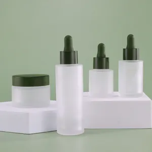 Wholesale Skincare Empty Cosmetics Glass Bottle Packaging Skin Care Bottle Packaging Hair Oil Bottle Set With Green Cap