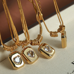 Collier en acier titane haut de gamme à double couche avec pendentif cœur géométrique rétro et chaîne serpent. - Product Image 1