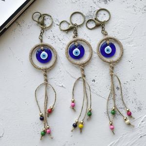 Cadeau tendance : Porte-monnaie porte-bonheur turc en alliage de zinc avec œil bleu et main de Hamsa - Pendentif pour sac/voiture/décoration intérieure - Product Image 1