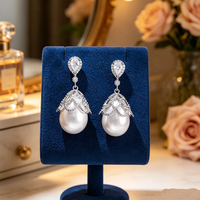 Boucles d'oreilles pendantes coréennes tendance en cuivre avec grandes perles et zircons pavés en forme de goutte, inaltérables, bijoux de mariage pour femmes 2026
