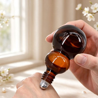 Flacon roll-on en verre ambré opaque en forme de gourde pour huile essentielle, flacon roll-on à bille en acier pour huile de massage beauté