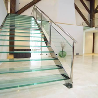 Escalier moderne en métal avec marches en verre trempé, garde-corps en verre, design droit pour usage intérieur, services personnalisés, garantie de 5 ans