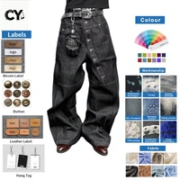 Jeans en denim délavé noir asymétrique à braguette boutonnée, coupe ample et jambe large, style streetwear, pour hommes, personnalisable OEM/ODM, faible MOQ
