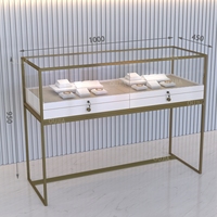 Vitrine à bijoux en or sur pied personnalisée en acier inoxydable avec éclairage LED pour magasin de bijoux