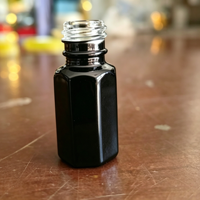 Flacons de parfum vintage noirs octogonaux gravés de 3 ml avec bouchon en forme de dôme de château et applicateur en verre