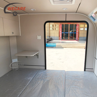 Roulotte de camping autonome Wecare avec cuisine extérieure, remorquable par SUV pour le camping hors réseau