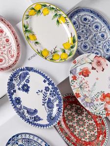Assiette de service ovale en céramique de 14 pouces à motifs floraux variés, nouveau design, pour la maison, les hôtels, le service et la décoration de table - Product Image 1