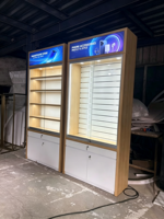 Vitrine d'exposition en bois pour accessoires électroniques commerciaux, présentoir de téléphones avec porte coulissante et éclairage LED