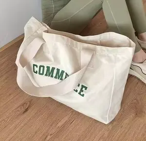 Bolsos de mano de mujer populares impresos con logotipo personalizado bolsos de compras de lona de algodón orgánico liso con cremallera y bolsillo