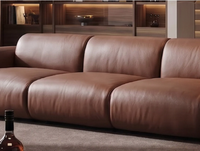 Canapé italien minimaliste importé en cuir pleine fleur de qualité supérieure, avec assise et accoudoirs en peluche épaisse, design ergonomique, pieds en noyer noir