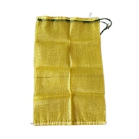 Nouveau sac en filet jaune en matériau PP avec cordon de serrage, sac en filet tissé universel adapté aux fruits, légumes, maïs et patates douces
