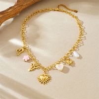 Collier multi-charmes en acier inoxydable plaqué or 18 carats, sans ternissement, pendentif en forme de cœur, de nœud et de fleur pour femmes et filles, bijoux