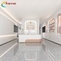 Comptoir de réception personnalisé blanc et or rose avec façade incurvée en U, éclairage LED, design ludique, mobilier pour hall, magasin d'enfants, salon