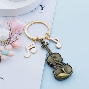 Llavero con nota musical de violín vintage, colgante para mochila, joyería de moda europea y americana, regalo creativo - Product Image 4